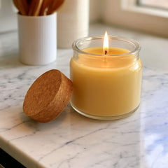 Blossom & Hive Beeswax Glass candle with wooden lid on a marble surface