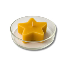 Blossom & Hive Beeswax star-shaped tealight in a clear glass dish on a white background