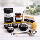 Collection of Blossom & Hive honey and skincare products on a light surface with a blurred background.