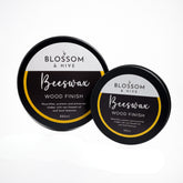 Two containers of Blossom & Hive Beeswax Wood Finish on a white background