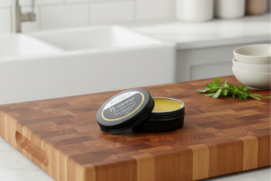 Blossom & Hive Beeswax Wood Finish on a wooden board, made from local beeswax and linseed oil for a food-safe, natural shine.