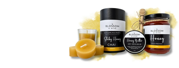 Sticky chai, local honey, honey balm and beeswax candles from Blossom & Hive on a white background with a splash of yellow at the back.  