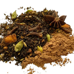  A close-up of Collombatti Naturals Raw Cacao Chai loose-leaf tea, showcasing a rich blend of Australian-grown black tea, aromatic spices like star anise, cardamom, and cloves, and finely ground raw cacao. This handcrafted chai delivers a bold, chocolatey twist with warm, spiced undertones - perfect for a comforting and indulgent tea experience.