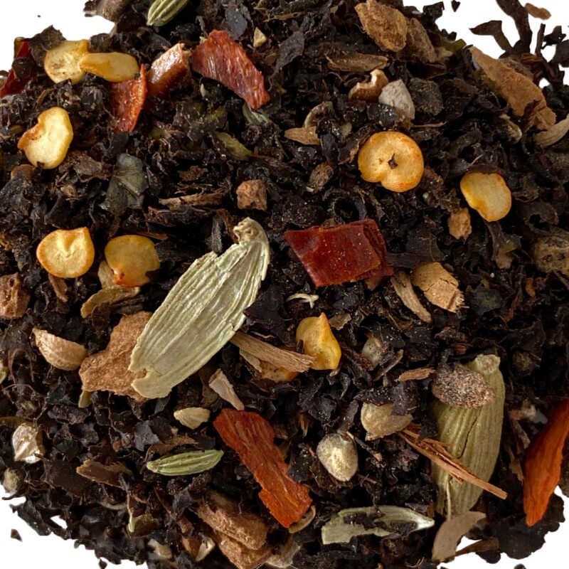 A close-up of Collombatti Naturals Chilli Chai loose-leaf tea, showcasing bold ingredients like dried chilli flakes, aromatic cardamom, cinnamon, and Australian-grown black tea. This handcrafted blend delivers a warming kick of spice, perfect for those who love a bold and invigorating chai experience.